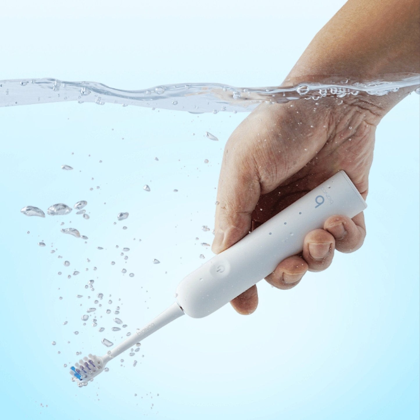 Bianca Bright oscillating toothbrush showing round brush head for plaque removal