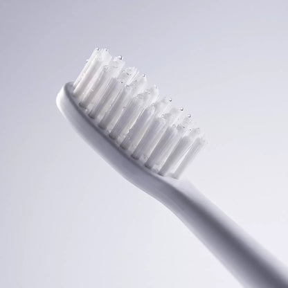 Macro of the Bianca Electric Toothbrush bristles with water droplets