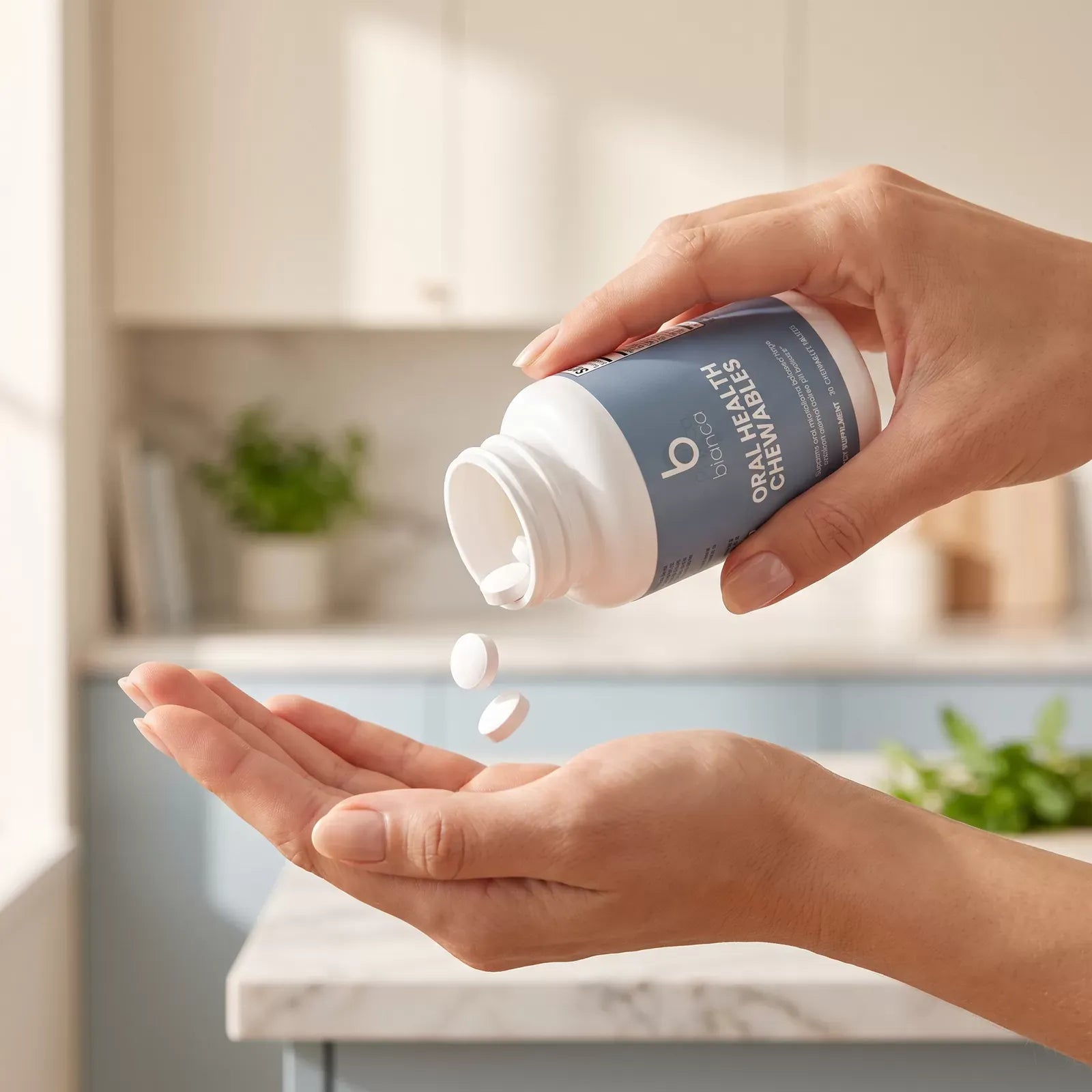 Hand pouring Bianca Oral Health Chewables tablets into an open palm