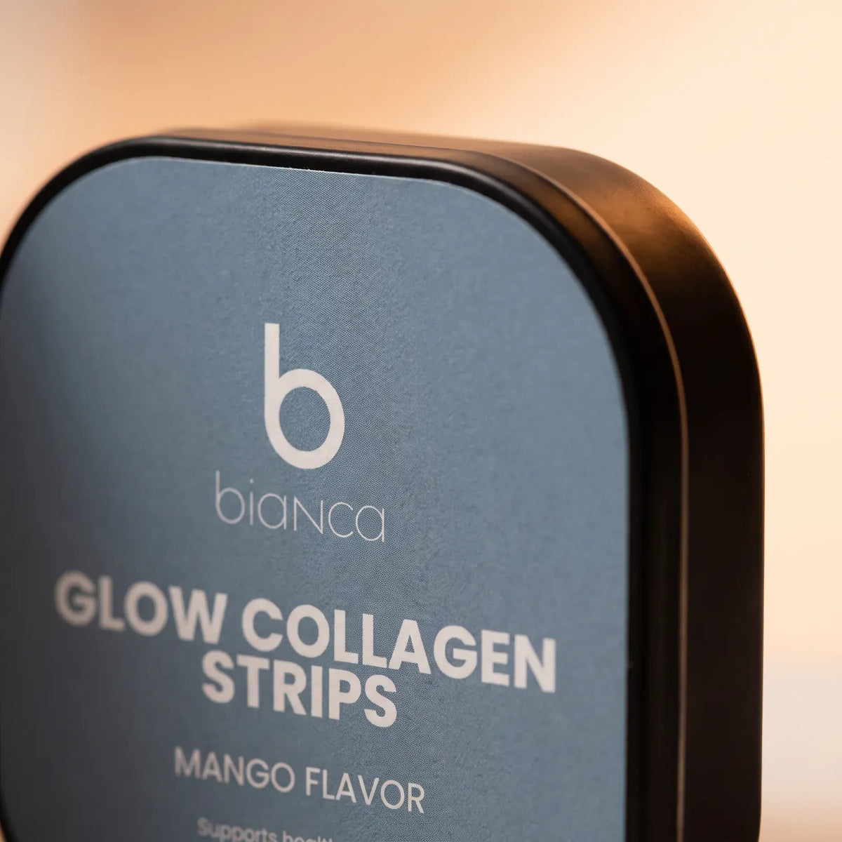 Close-up of the Bianca Glow Collagen Strips lid label, mango flavor